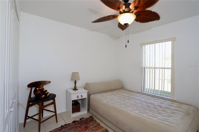 7 Sequoia Way, Kissimmee, FL 34758 - bedroom featuring multiple windows, light tile patterned floors, and baseboards