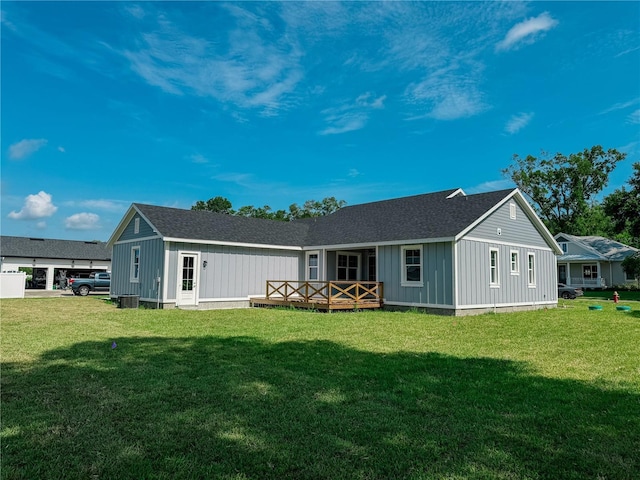 311 W Delaware Ave, Lake Helen, FL 32744 - back of property featuring a lawn, board and batten siding, and roof with shingles