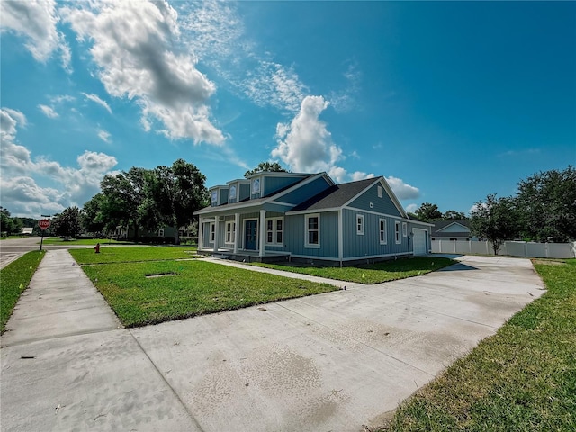 311 W Delaware Ave, Lake Helen, FL 32744 - view of front of home featuring driveway and a porch