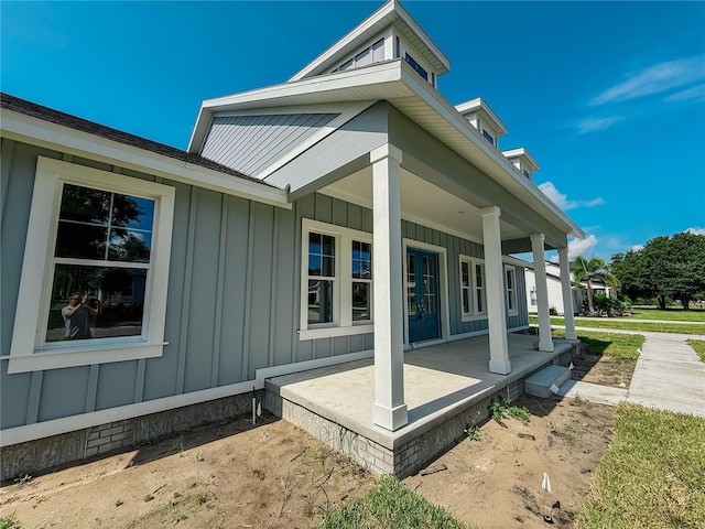 311 W Delaware Ave, Lake Helen, FL 32744 - view of home's exterior with board and batten siding and covered porch