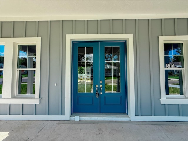 311 W Delaware Ave, Lake Helen, FL 32744 - doorway to property with french doors and board and batten siding
