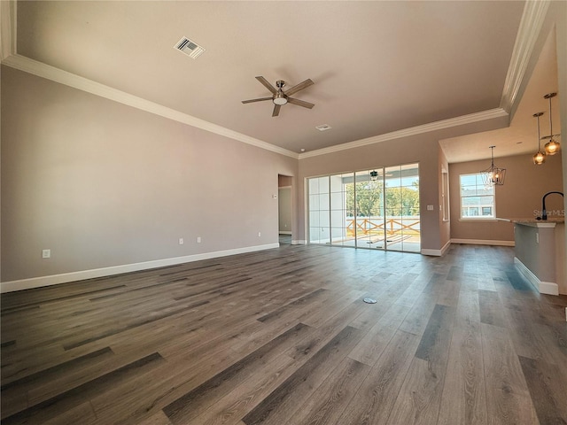 311 W Delaware Ave, Lake Helen, FL 32744 - empty room featuring a ceiling fan, baseboards, dark wood-type flooring, ornamental molding, and a chandelier