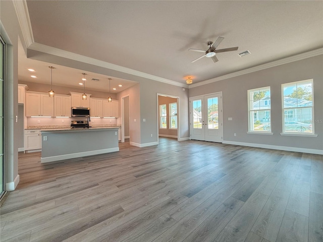 311 W Delaware Ave, Lake Helen, FL 32744 - unfurnished living room with ceiling fan, light wood-type flooring, baseboards, crown molding, and recessed lighting