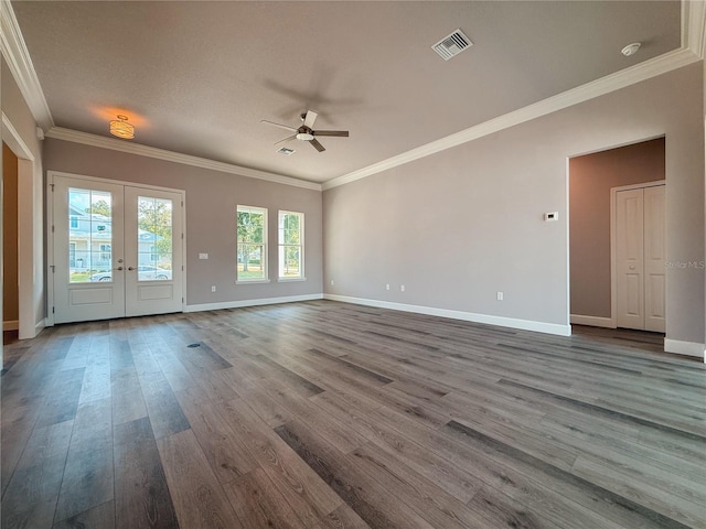 311 W Delaware Ave, Lake Helen, FL 32744 - spare room with a ceiling fan, dark wood-style floors, french doors, baseboards, and crown molding