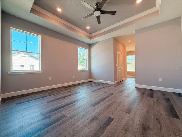 311 W Delaware Ave, Lake Helen, FL 32744 - empty room with a raised ceiling, ornamental molding, dark wood finished floors, ceiling fan, and baseboards