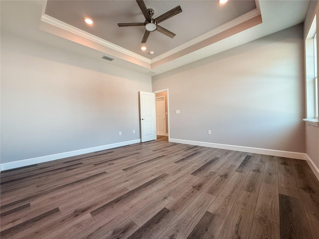 311 W Delaware Ave, Lake Helen, FL 32744 - empty room featuring a raised ceiling, crown molding, ceiling fan, wood finished floors, and recessed lighting