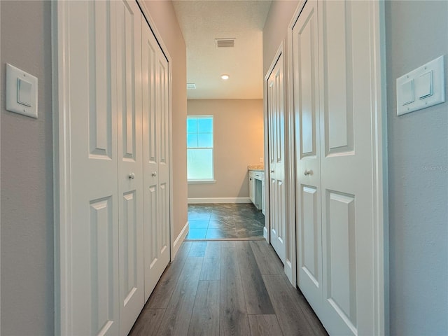 311 W Delaware Ave, Lake Helen, FL 32744 - hall with dark wood-style floors and baseboards