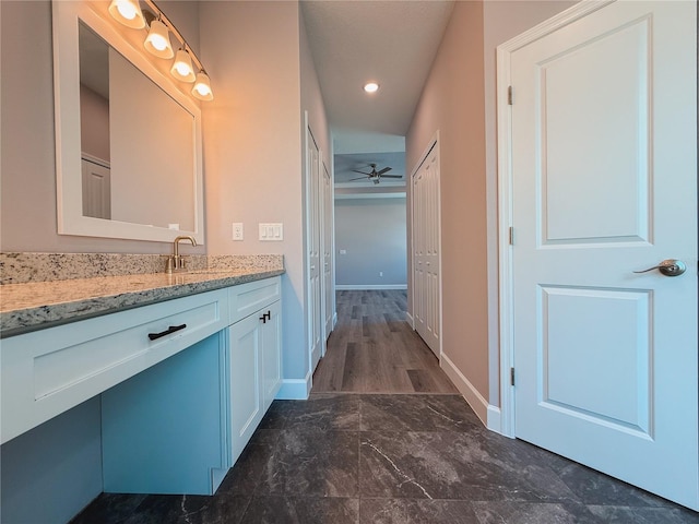 311 W Delaware Ave, Lake Helen, FL 32744 - bathroom featuring vanity, baseboards, ceiling fan, and marble finish floors