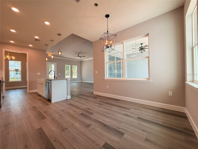 311 W Delaware Ave, Lake Helen, FL 32744 - kitchen featuring a chandelier, a ceiling fan, open floor plan, dark wood finished floors, and recessed lighting