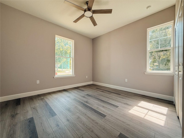 311 W Delaware Ave, Lake Helen, FL 32744 - spare room with plenty of natural light, ceiling fan, and dark wood finished floors