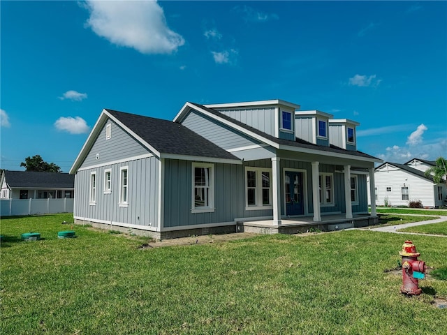 311 W Delaware Ave, Lake Helen, FL 32744 - view of front of home featuring board and batten siding, covered porch, and roof with shingles