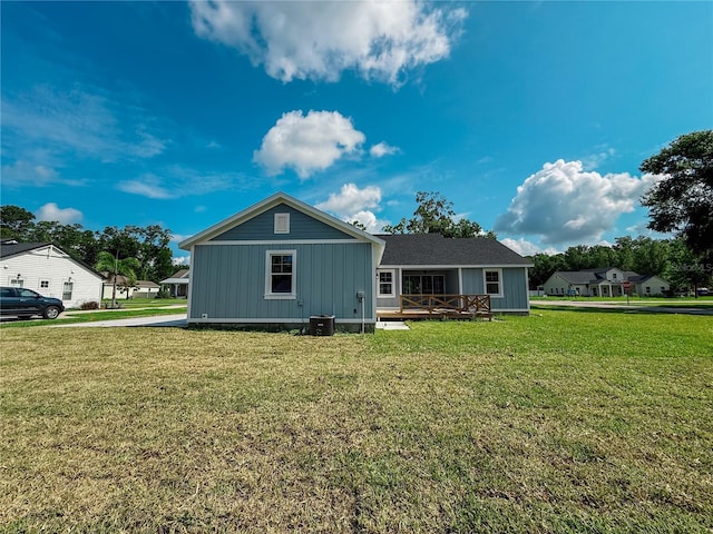 311 W Delaware Ave, Lake Helen, FL 32744 - view of front of property featuring a front yard, a deck, and board and batten siding