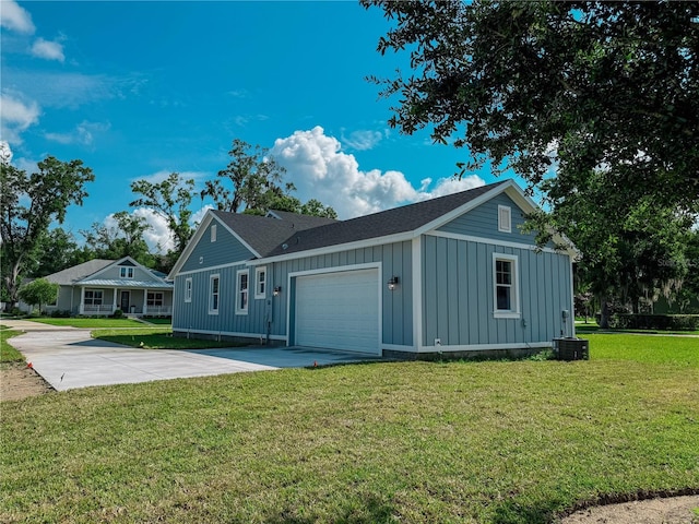 311 W Delaware Ave, Lake Helen, FL 32744 - view of front facade featuring board and batten siding, driveway, a garage, and a front yard