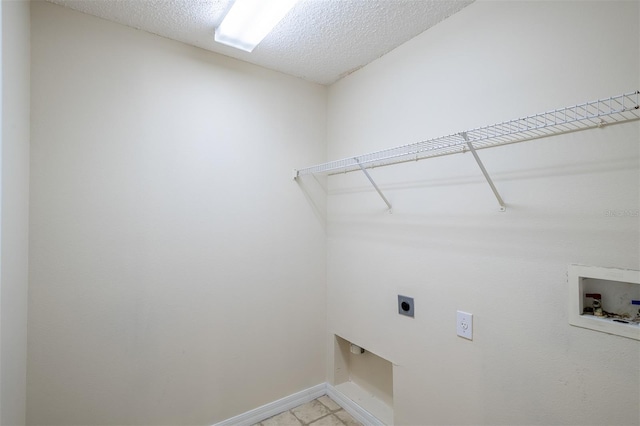 3199 Quail Dr, Deltona, FL 32738 - clothes washing area featuring a textured ceiling, electric dryer hookup, laundry area, baseboards, and hookup for a washing machine