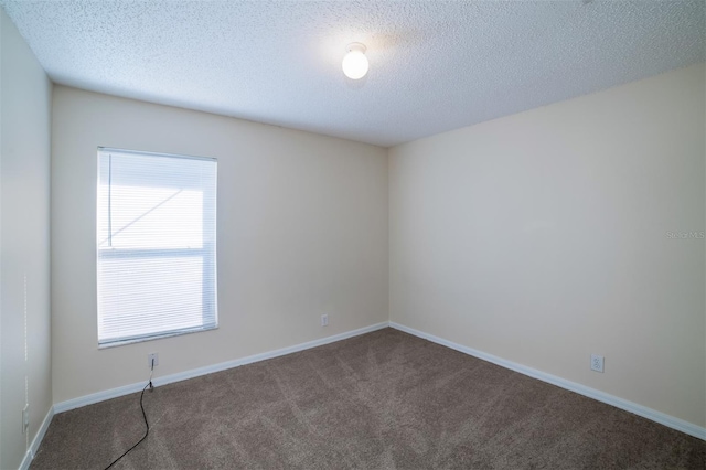 3199 Quail Dr, Deltona, FL 32738 - empty room with carpet flooring, baseboards, and a textured ceiling