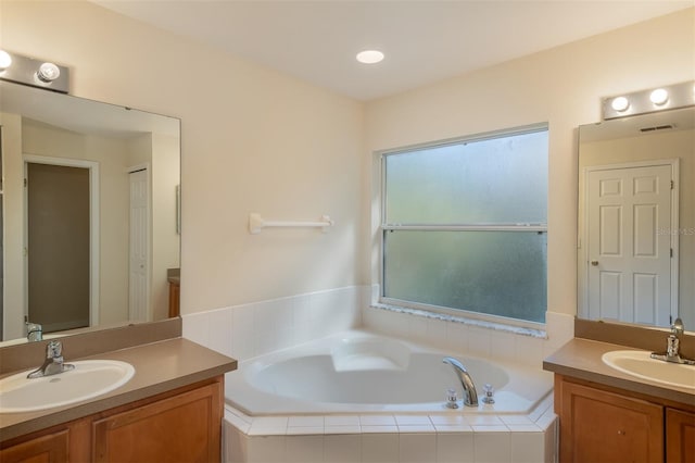 3199 Quail Dr, Deltona, FL 32738 - full bath with a bath, a sink, and two vanities