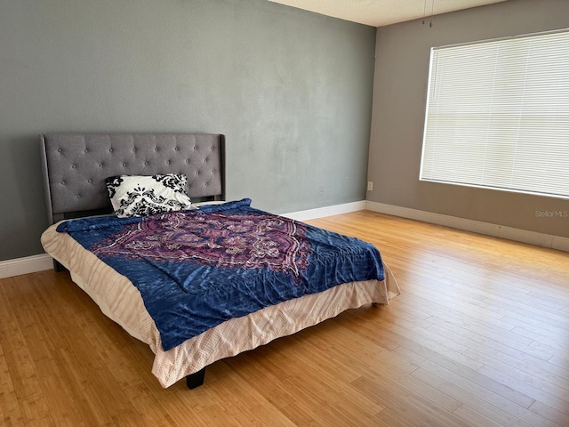 3024 Natoma Way, Orlando, FL 32825 - bedroom featuring wood finished floors and baseboards