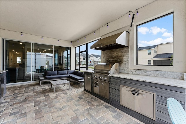 1799 Tropical Palms Cir, Kissimmee, FL 34747 - view of patio / terrace featuring an outdoor hangout area and exterior kitchen