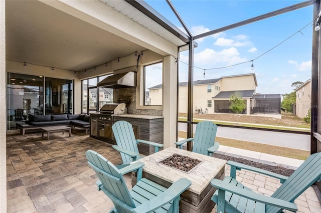 1799 Tropical Palms Cir, Kissimmee, FL 34747 - view of patio featuring an outdoor living space with a fire pit and an outdoor kitchen