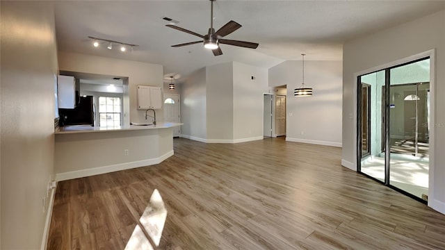 213 Almaden Ct, Winter Springs, FL 32708 - unfurnished living room with wood finished floors, a sink, baseboards, and ceiling fan