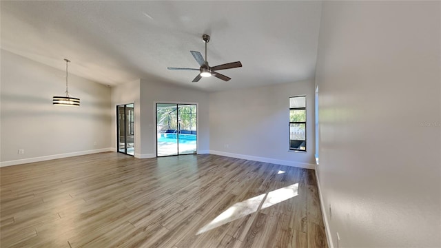 213 Almaden Ct, Winter Springs, FL 32708 - spare room with a ceiling fan, baseboards, lofted ceiling, and wood finished floors