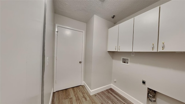 213 Almaden Ct, Winter Springs, FL 32708 - laundry room with washer hookup, a textured ceiling, light wood-type flooring, hookup for an electric dryer, and cabinet space