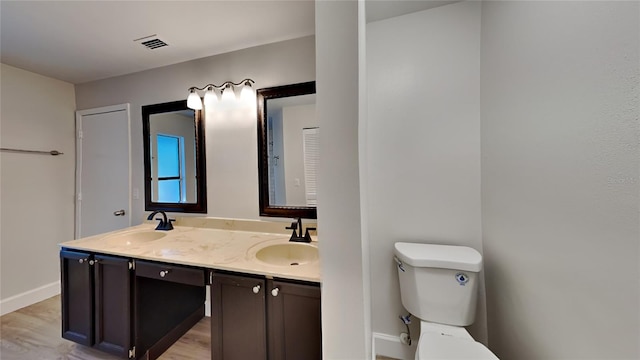 213 Almaden Ct, Winter Springs, FL 32708 - bathroom featuring double vanity, visible vents, toilet, and a sink