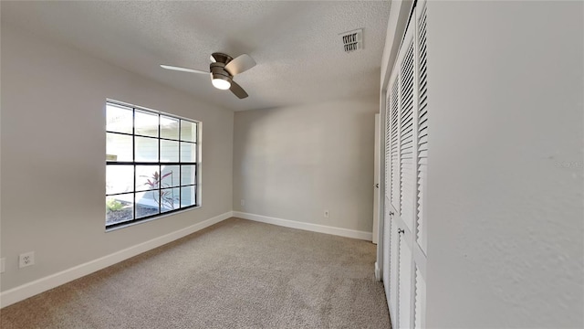 213 Almaden Ct, Winter Springs, FL 32708 - unfurnished bedroom with carpet flooring, baseboards, a textured ceiling, visible vents, and a closet