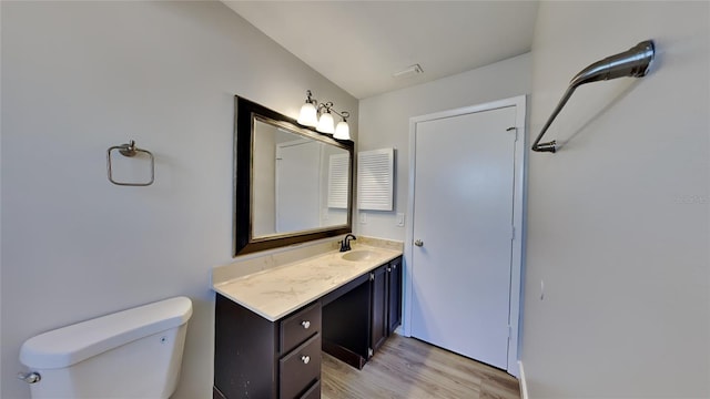 213 Almaden Ct, Winter Springs, FL 32708 - bathroom with toilet, vanity, and wood finished floors