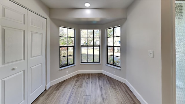 213 Almaden Ct, Winter Springs, FL 32708 - empty room with baseboards and light wood-style floors