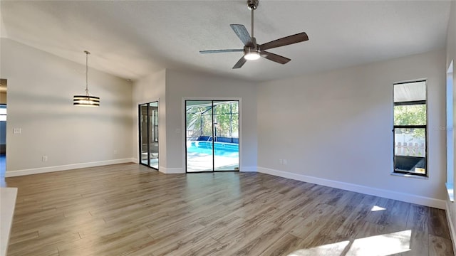 213 Almaden Ct, Winter Springs, FL 32708 - unfurnished room with lofted ceiling, ceiling fan, wood finished floors, and plenty of natural light