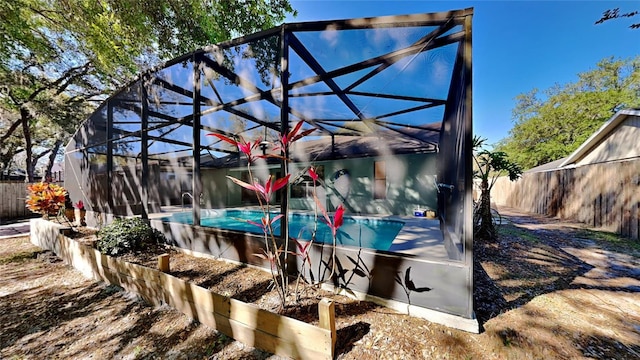 213 Almaden Ct, Winter Springs, FL 32708 - exterior space featuring glass enclosure, fence, and a fenced in pool