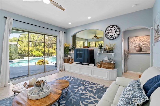 13136 Peregrin Cir, Bradenton, FL 34212 - living area with ceiling fan, arched walkways, tile patterned flooring, and recessed lighting