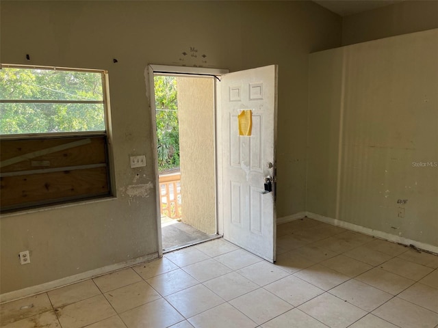 2918 E Waters Ave, Tampa, FL 33604 - foyer entrance with light tile patterned flooring and baseboards