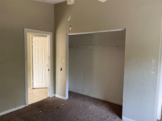 2918 E Waters Ave, Tampa, FL 33604 - unfurnished bedroom with a closet, baseboards, and carpet