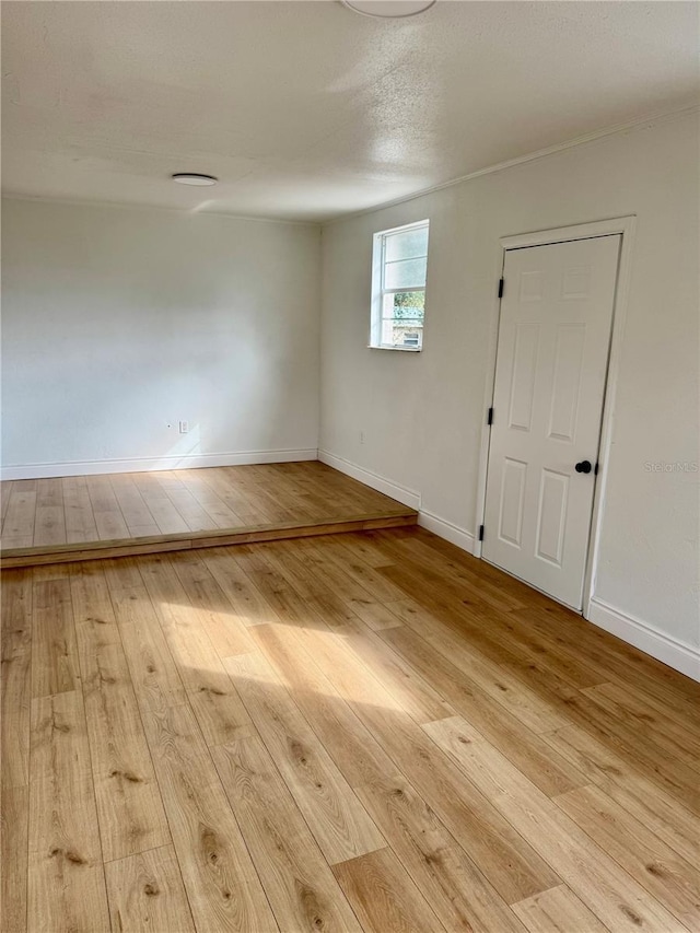 701 N 4th St, Haines City, FL 33844 - empty room featuring baseboards and hardwood / wood-style floors