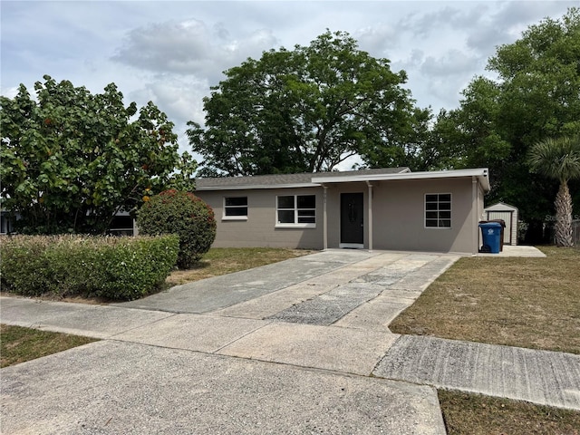 701 N 4th St, Haines City, FL 33844 - ranch-style home featuring driveway and an outbuilding