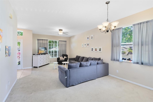 living area with plenty of natural light, carpet, and baseboards