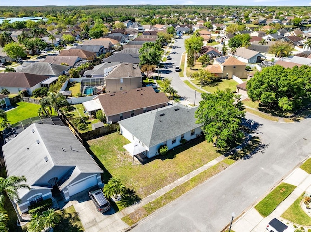 birds eye view of property with a residential view