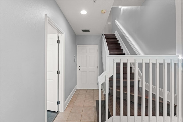 1563 Common Way Rd, Orlando, FL 32814 - stairway featuring tile patterned floors and baseboards