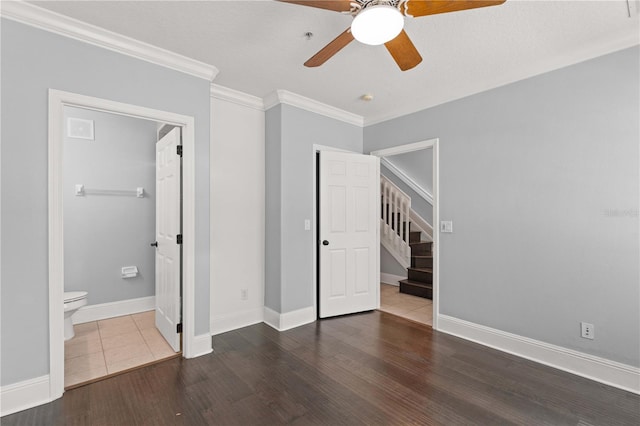 1563 Common Way Rd, Orlando, FL 32814 - unfurnished bedroom featuring crown molding, wood finished floors, ensuite bathroom, and ceiling fan