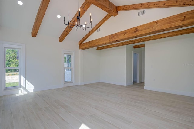 empty room with a notable chandelier, vaulted ceiling with beams, visible vents, and light wood-type flooring