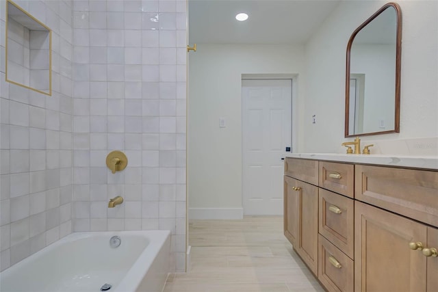 full bath featuring recessed lighting, baseboards, and vanity