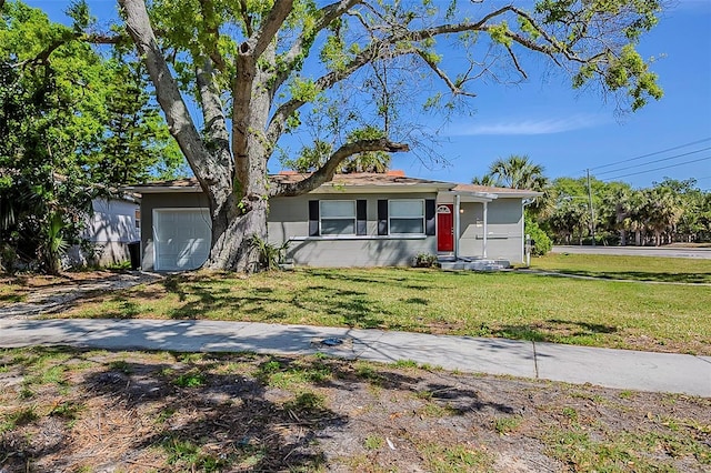 3645 6th St S, Saint Petersburg, FL 33705 - single story home featuring a front yard and a garage