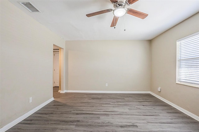 3645 6th St S, Saint Petersburg, FL 33705 - spare room featuring baseboards, visible vents, a ceiling fan, and wood finished floors