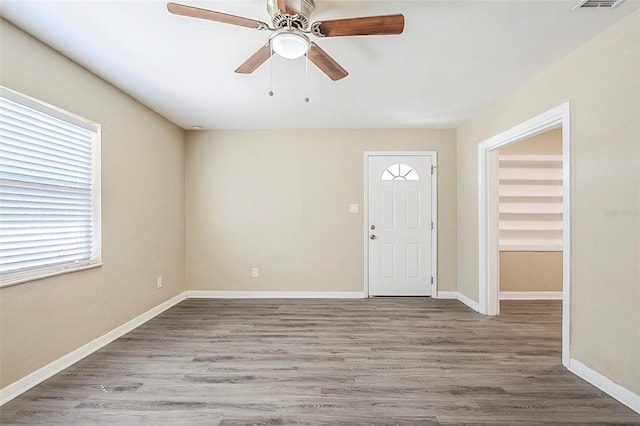 3645 6th St S, Saint Petersburg, FL 33705 - foyer featuring a ceiling fan, visible vents, baseboards, and wood finished floors