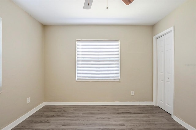 3645 6th St S, Saint Petersburg, FL 33705 - spare room with a ceiling fan, baseboards, and wood finished floors