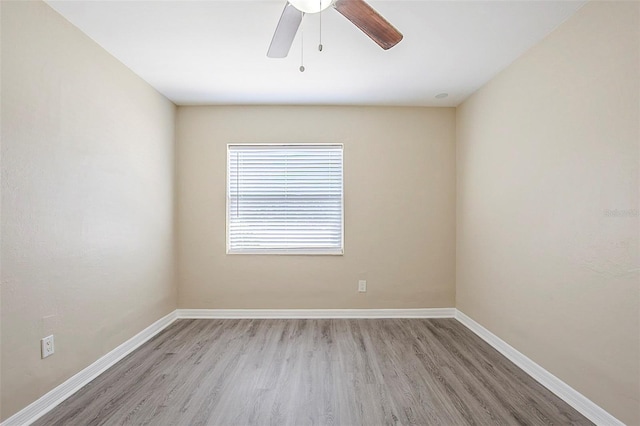 3645 6th St S, Saint Petersburg, FL 33705 - unfurnished room with baseboards, light wood-style floors, and a ceiling fan