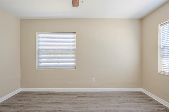 3645 6th St S, Saint Petersburg, FL 33705 - unfurnished room with baseboards and wood finished floors