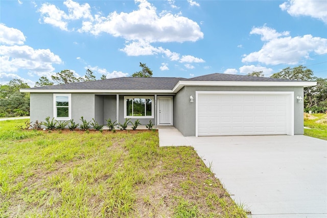 ranch-style home with concrete driveway, an attached garage, a front lawn, and stucco siding